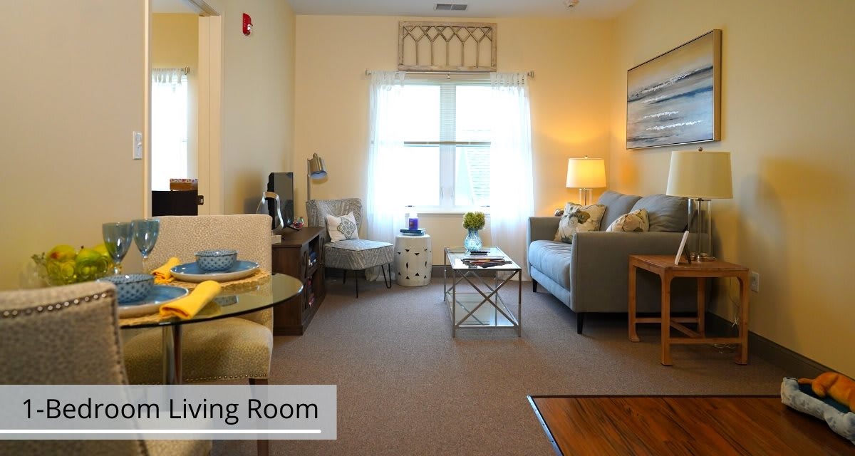 A cozy living room with comfortable seating and warm lighting.