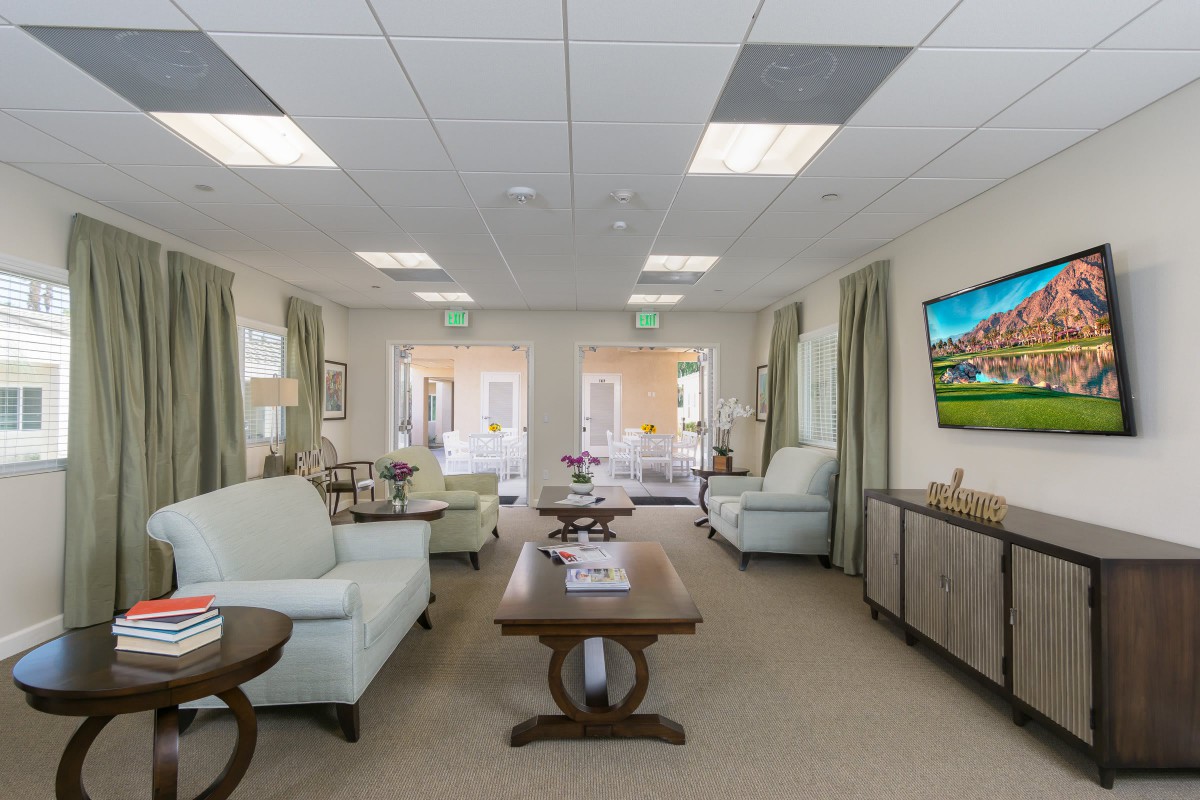 A spacious and well-lit waiting room with comfortable seating and modern decor.