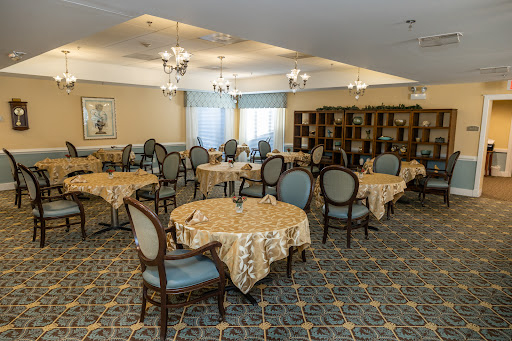A beautifully arranged dining room with elegant tables and chairs.