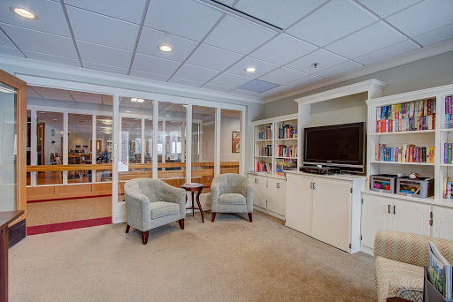 A cozy living room area featuring two chairs and a television unit, inviting relaxation and leisure.
