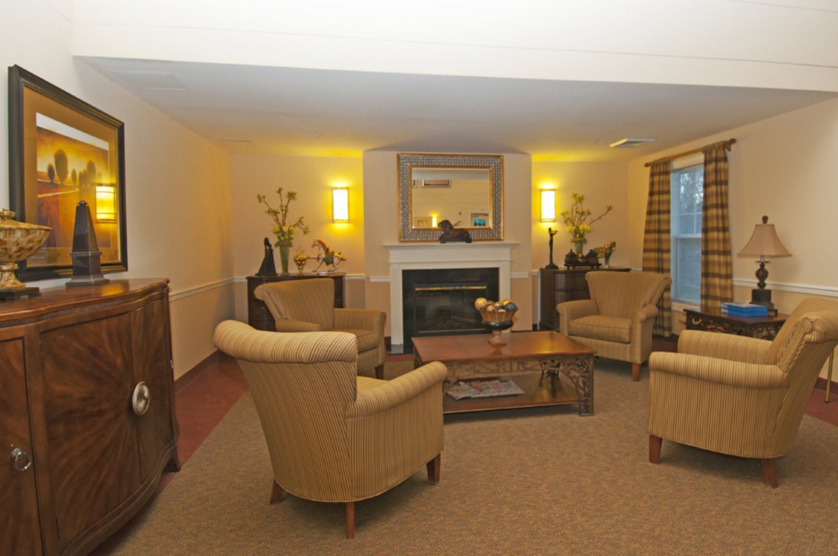 Cozy living room with comfortable seating and a fireplace.