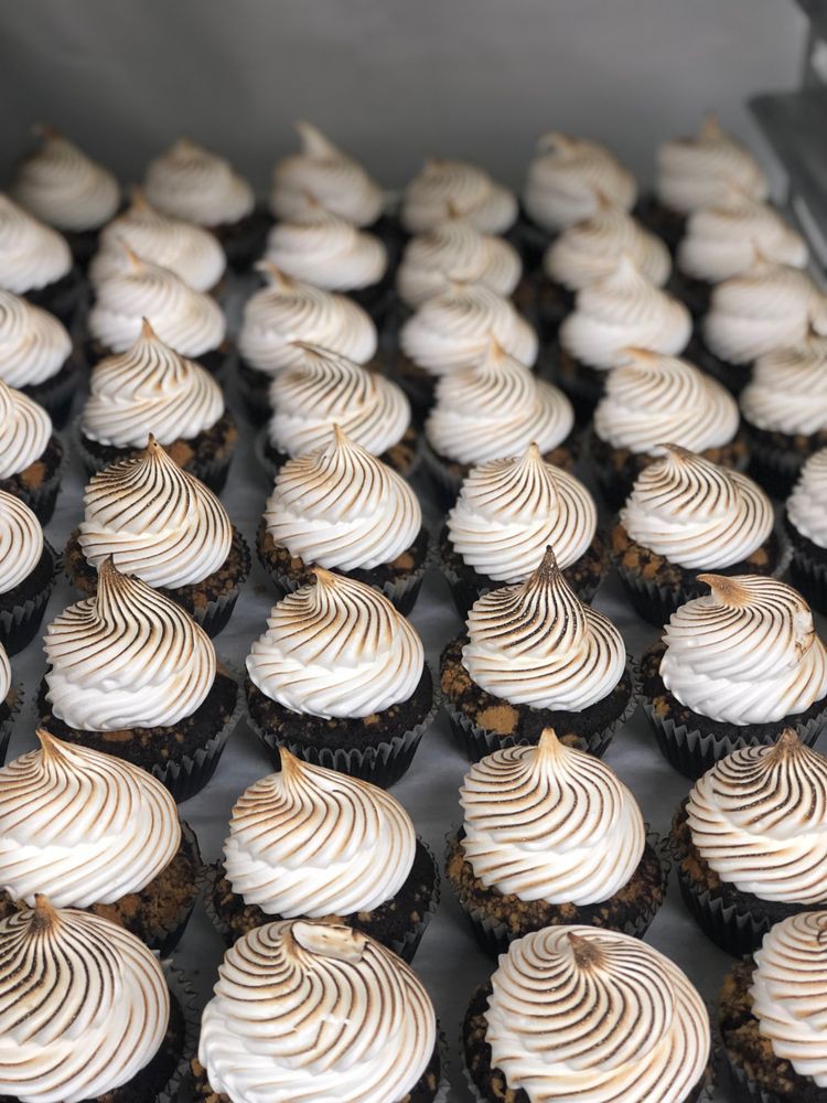 A delicious batch of cupcakes with perfectly swirled frosting.