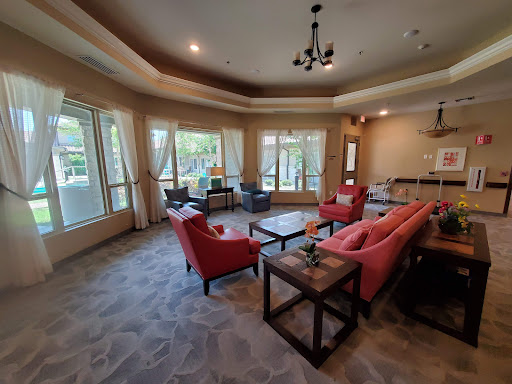 A cozy living room with comfortable seating and plenty of natural light.