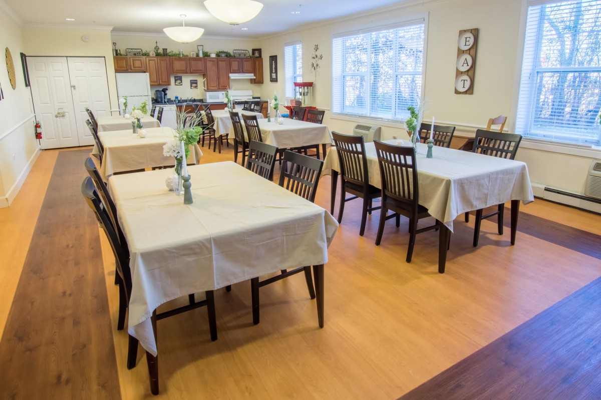 A cozy dining area with neatly arranged tables and chairs.