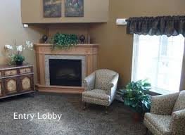 Cozy entry lobby with a fireplace and comfortable seating.