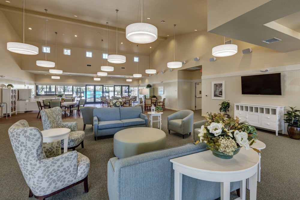 A modern lounge with comfortable seating and stylish lighting.