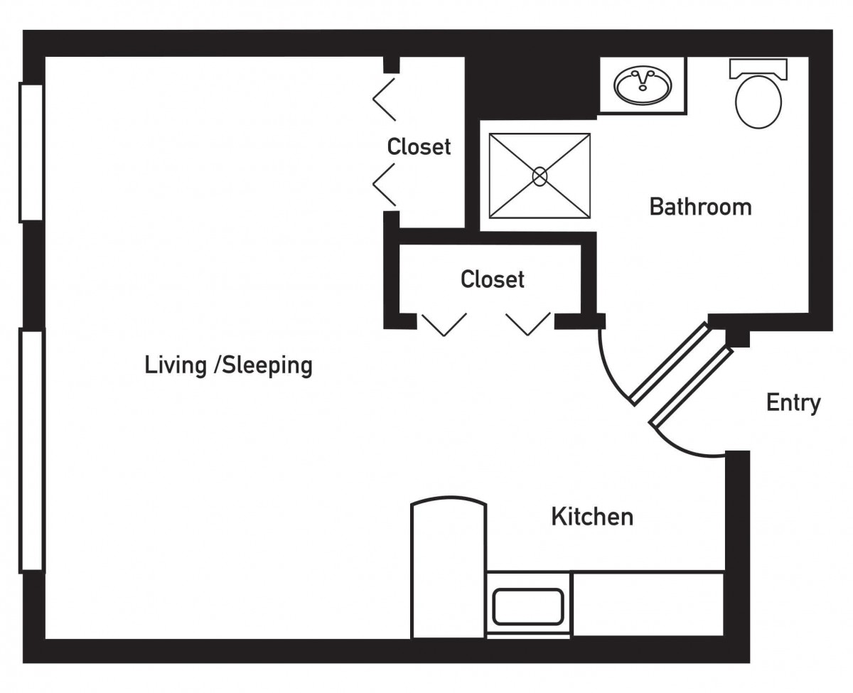 A floor plan of a studio apartment showing the layout with living/sleeping area, kitchen, bathroom, and closets.