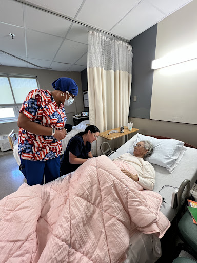 Healthcare professionals providing care to a hospitalized patient.