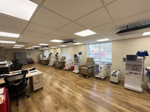 A well-organized healthcare facility with treatment chairs and medical equipment.