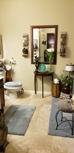 A beautifully styled bathroom featuring elegant decor and plant accents.