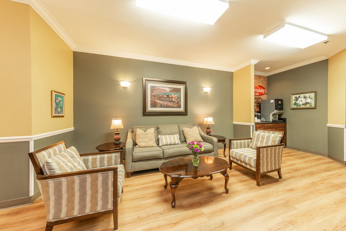 A cozy living room with comfortable seating and warm lighting.