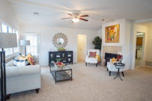 A bright and modern living room with stylish furniture and decor.