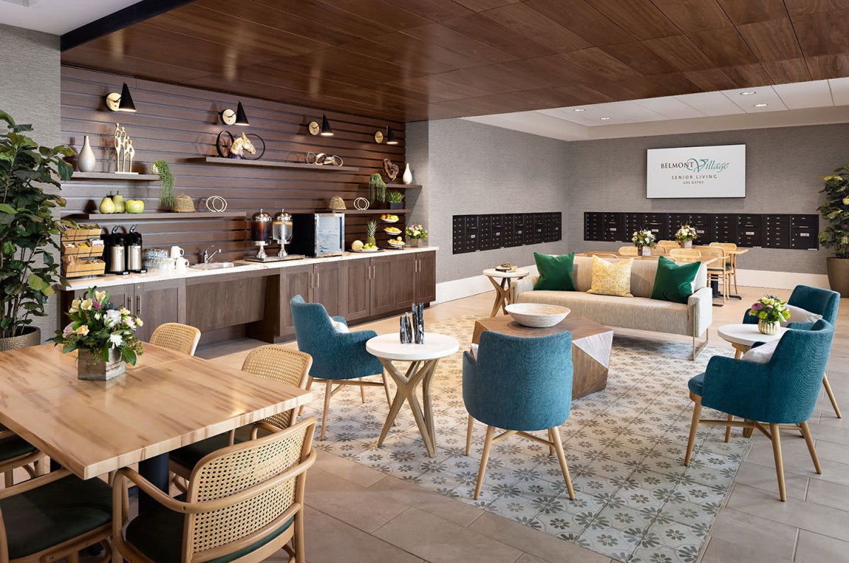 A modern and cozy lounge area featuring comfortable seating, stylish decor, and a well-equipped kitchenette.