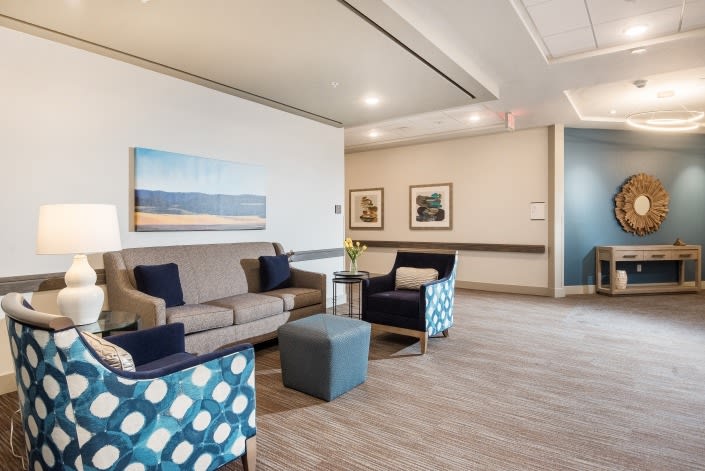 A modern lounge area featuring comfortable seating and stylish decor.