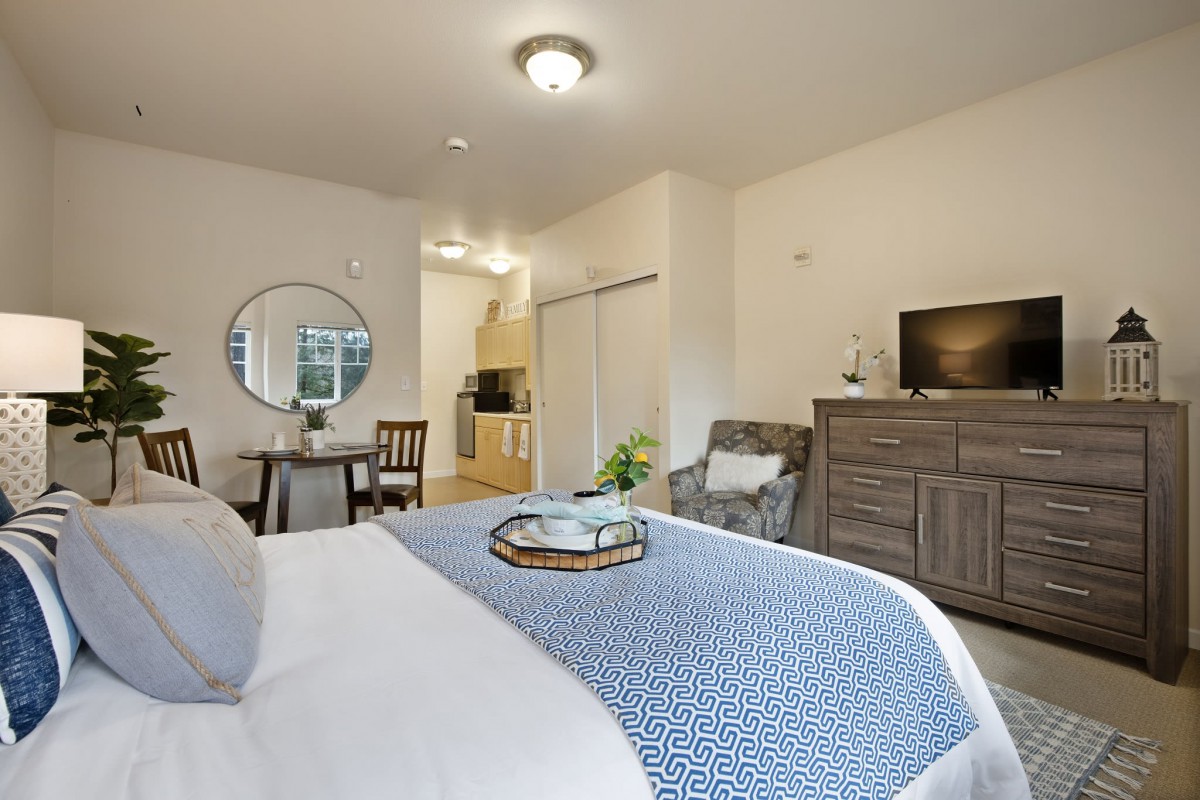 A cozy and modern bedroom with decorative elements and stylish furniture.