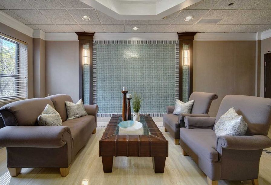 A contemporary living room with comfortable seating and elegant decor.