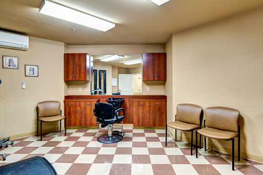 A minimalistic barbershop interior featuring a central barber chair and waiting area.