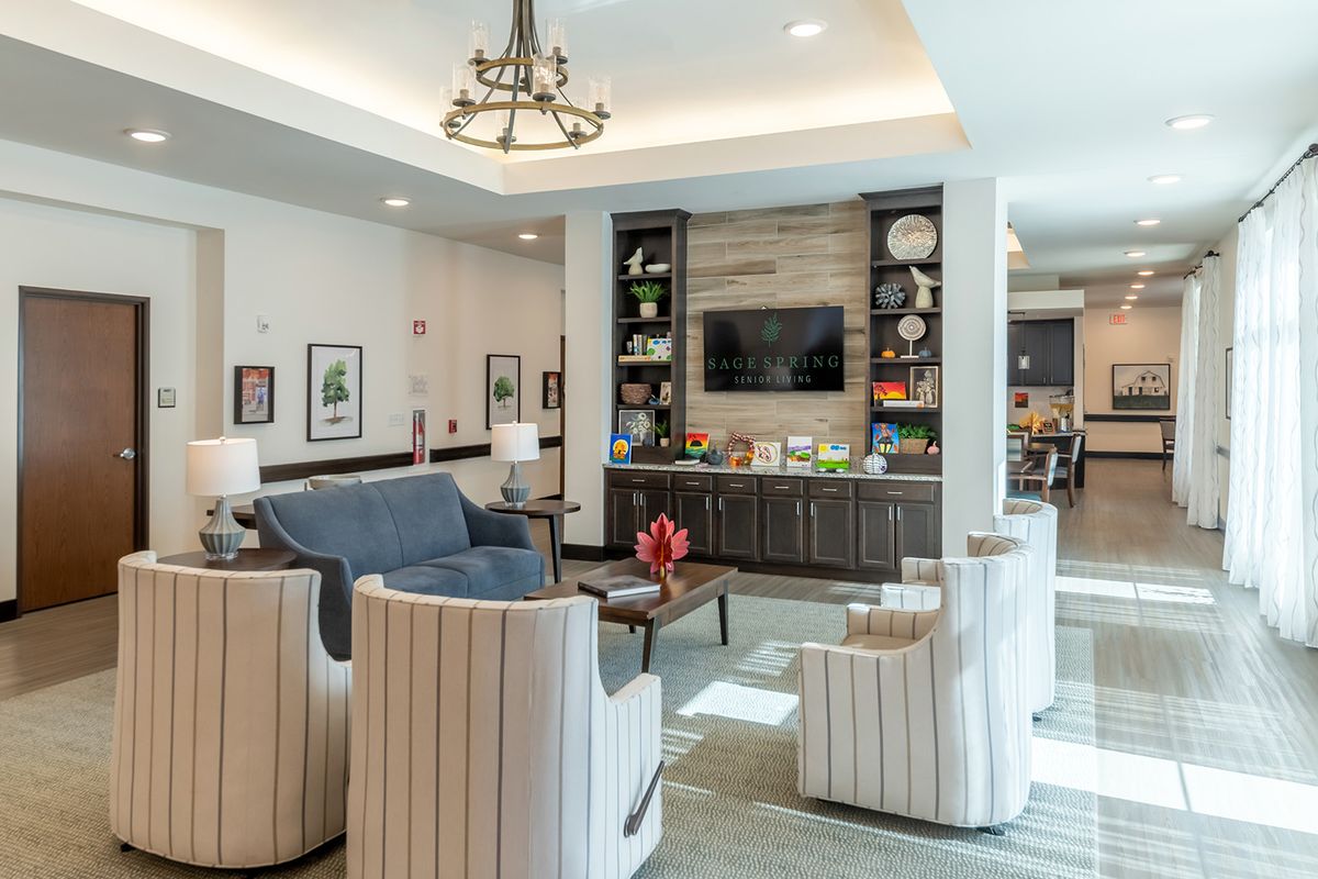 A modern living room with comfortable seating and a TV.