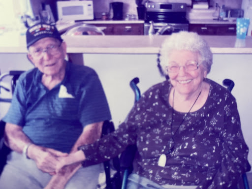 A joyful moment shared between an elderly couple, showcasing love and companionship.