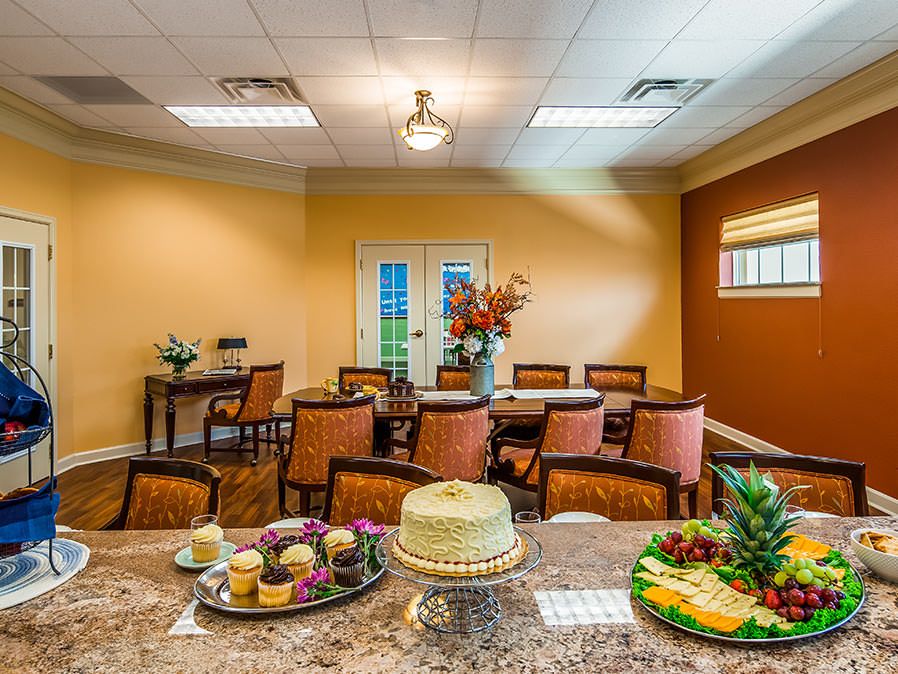 A well-decorated dining area featuring a variety of food items on the table.