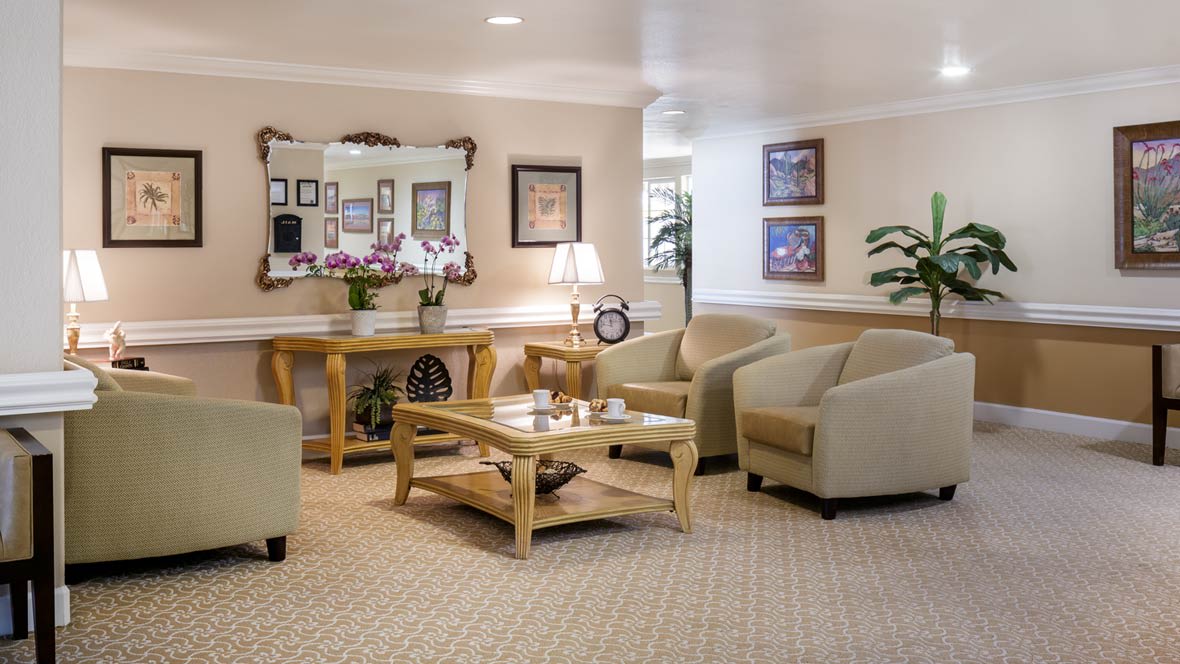 A cozy living room area with comfortable seating and elegant decor.