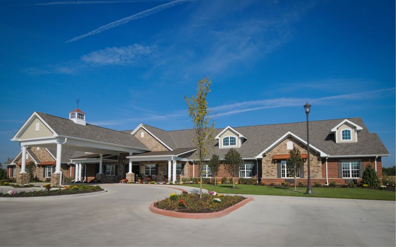 A suburban residential building under a clear blue sky.