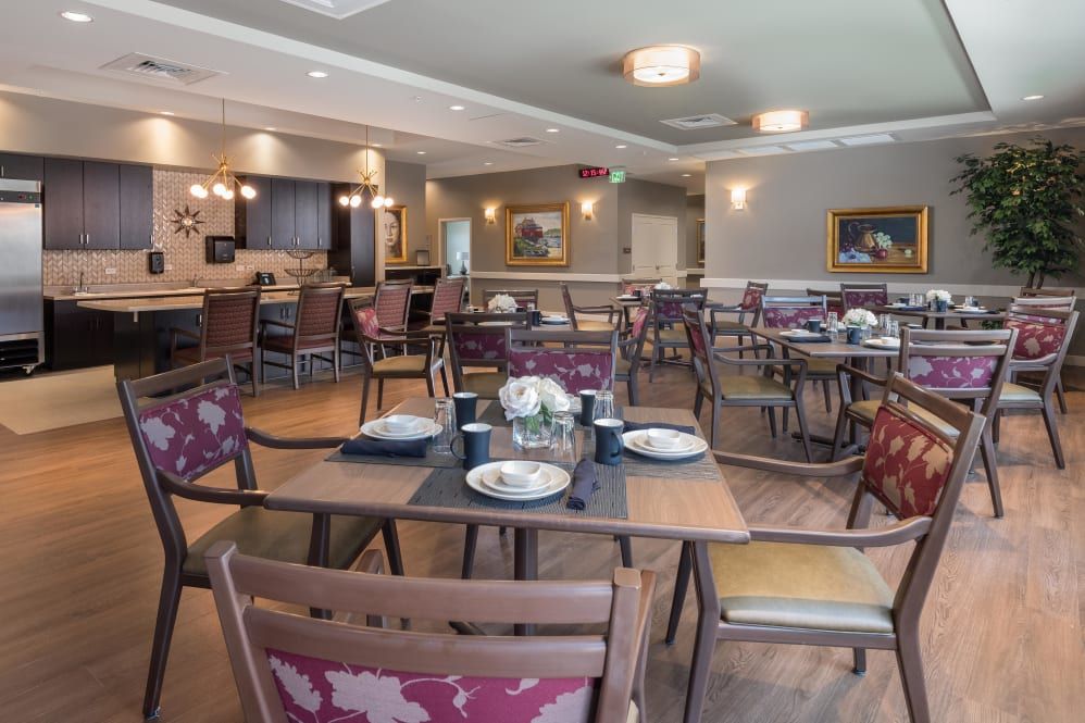 A cozy dining area with neatly arranged tables and chairs, ready for guests.