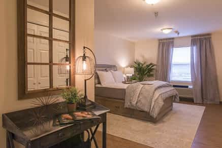 A cozy, modern bedroom with stylish decor and furnishings.