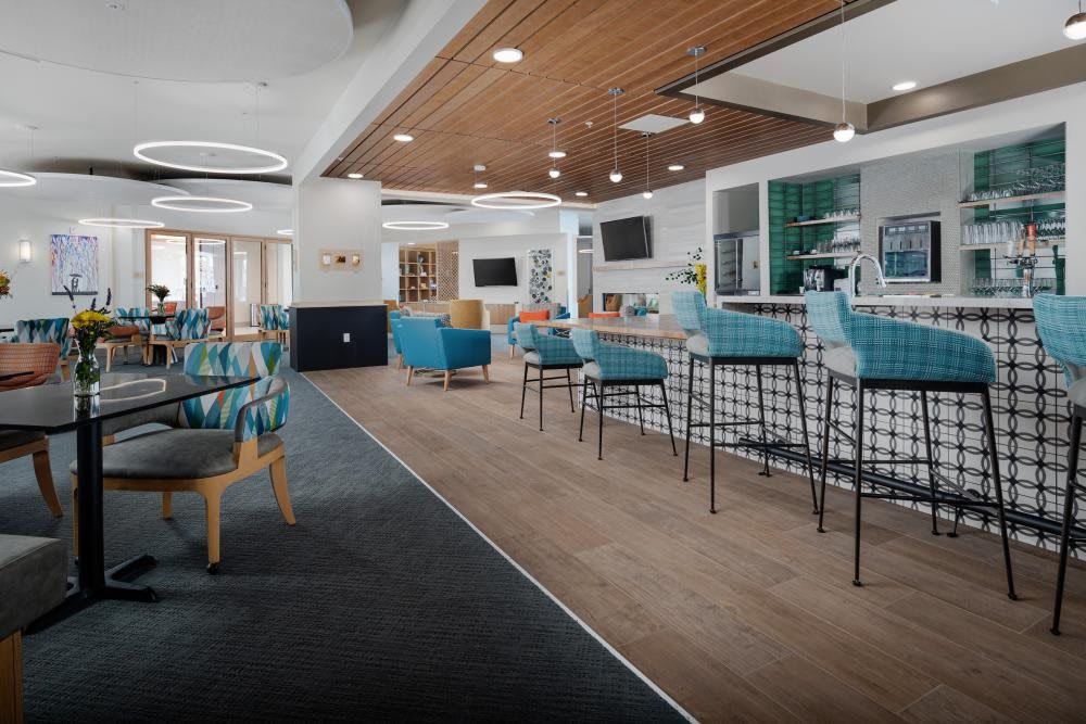 A modern lounge with contemporary seating and a sleek bar area.