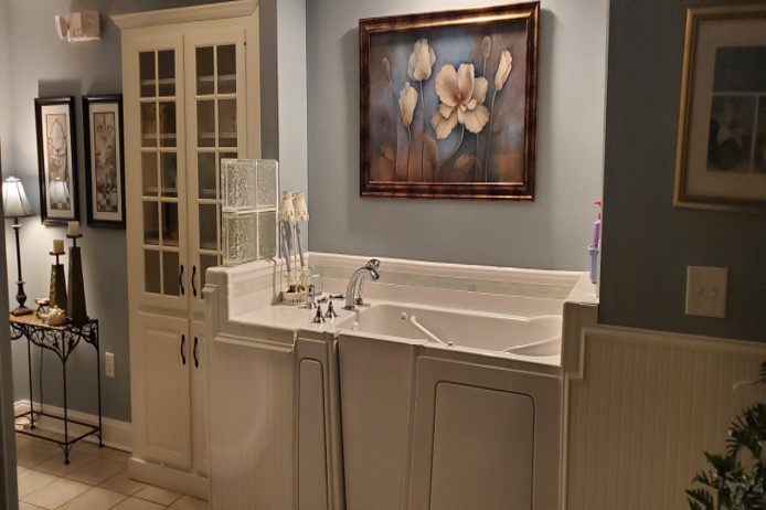 A beautifully designed bathroom sink area featuring elegant artwork and sophisticated decor.