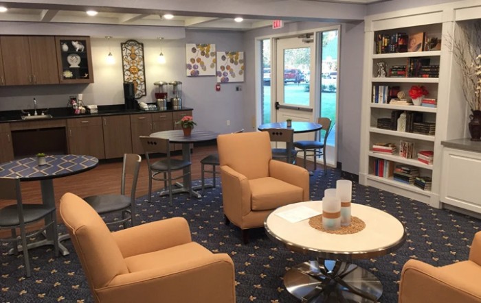 A cozy lobby with comfortable seating and a coffee station.