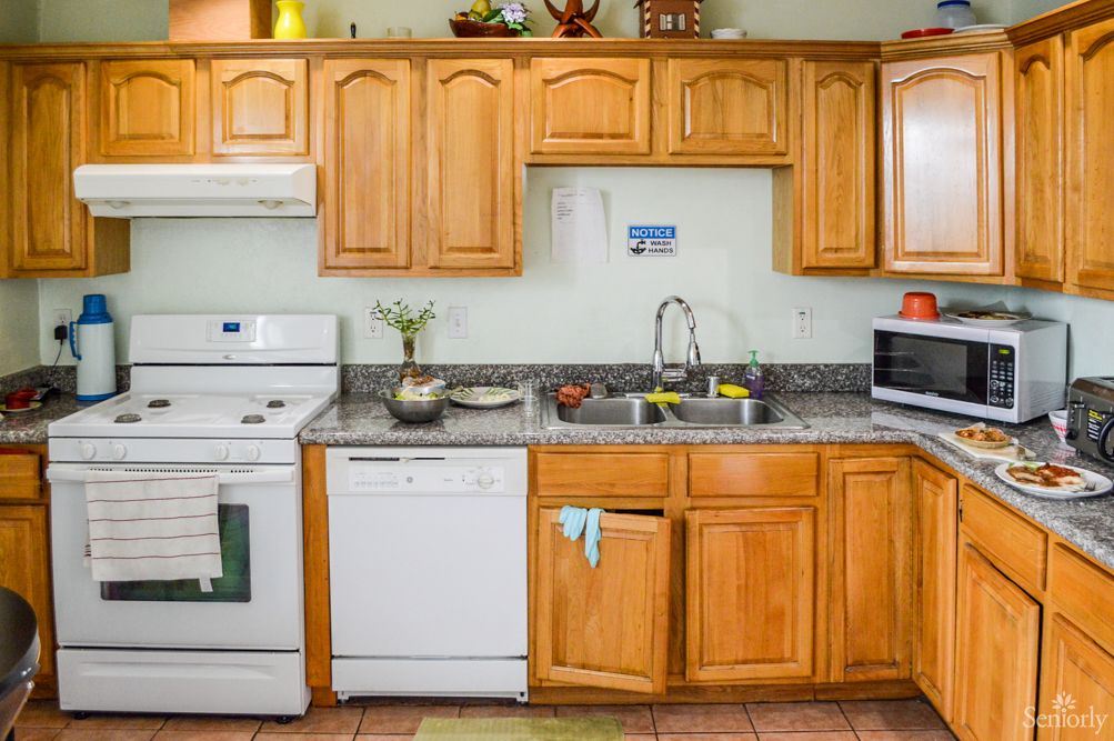 A well-equipped kitchen with wooden cabinets and modern appliances.