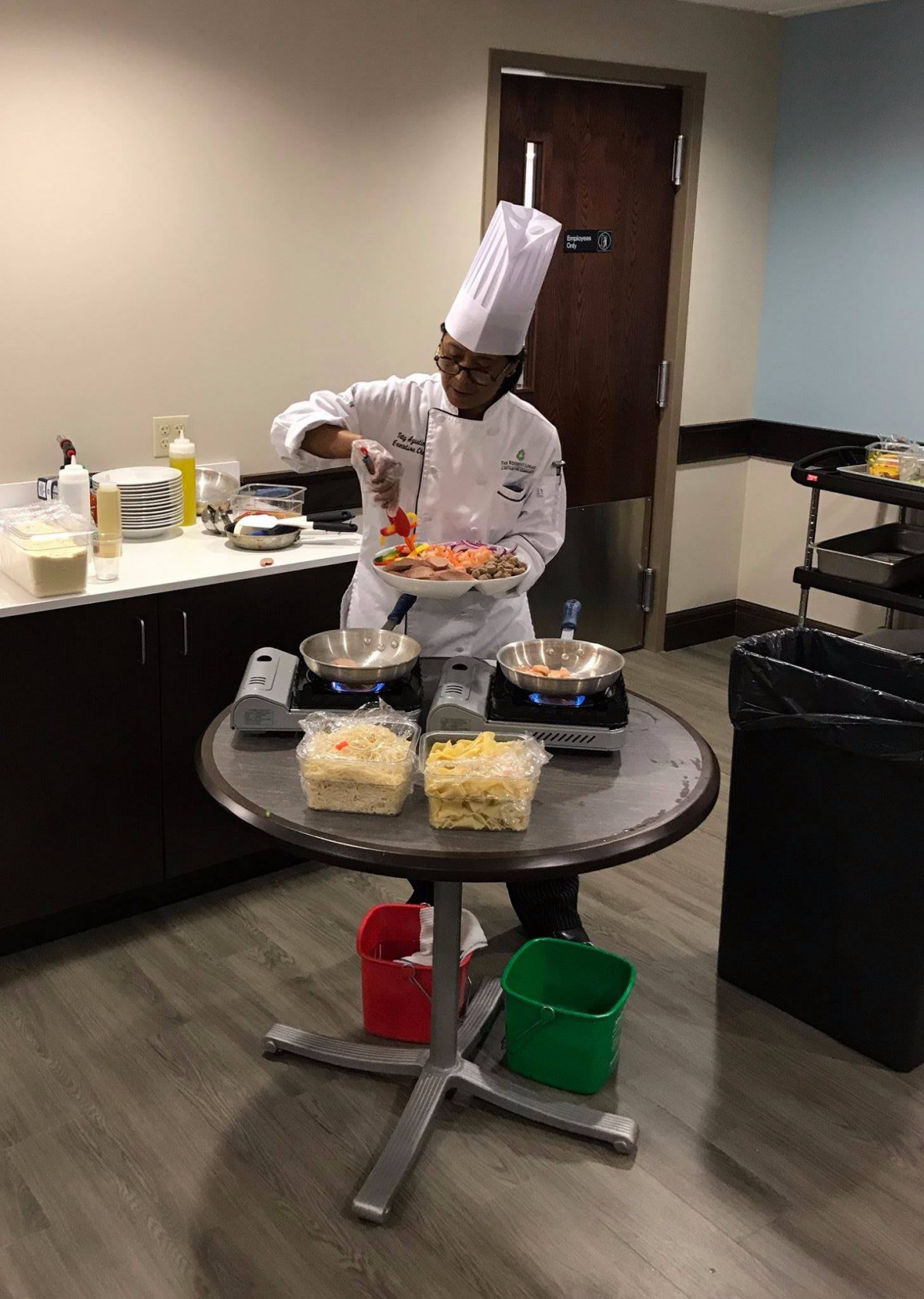 Chef preparing a dish in a kitchen setting.