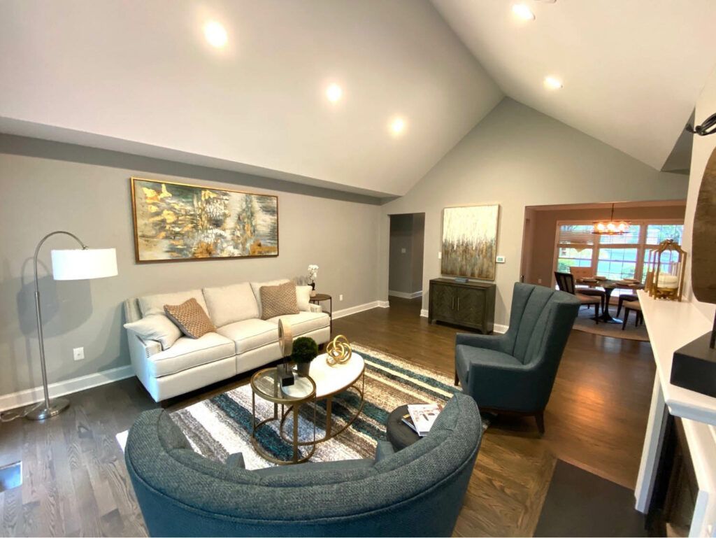 A modern living room with comfortable seating and elegant decor.
