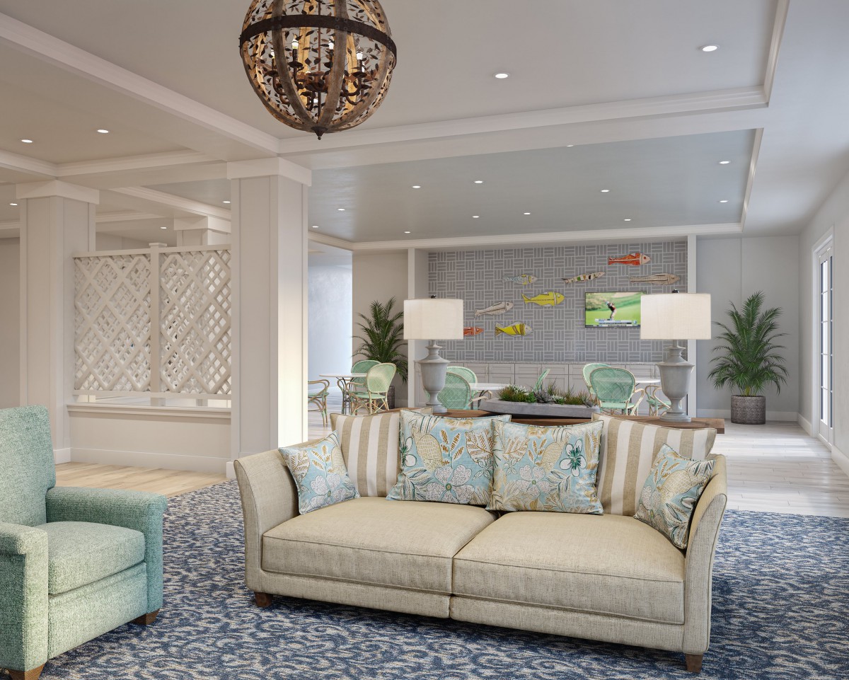 A beautifully decorated living room featuring a comfortable sofa, elegant chandelier, and stylish decor.