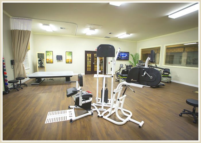 A well-equipped gym with a variety of fitness machines and exercise equipment.