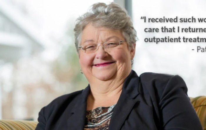 A smiling woman in formal attire with a quote about receiving outpatient care.