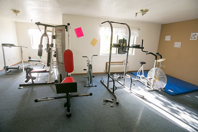 A small indoor gym with various exercise equipment.