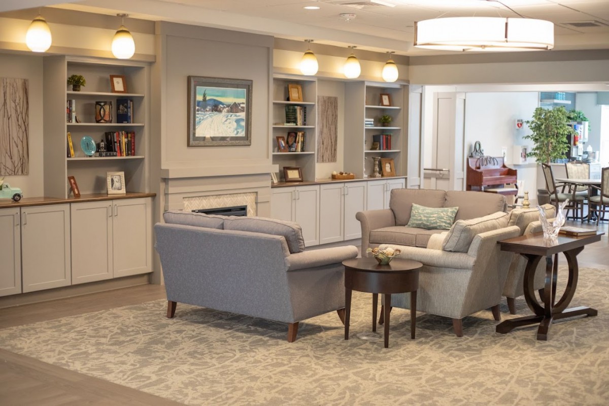 A cozy living room with comfortable seating and built-in shelves.