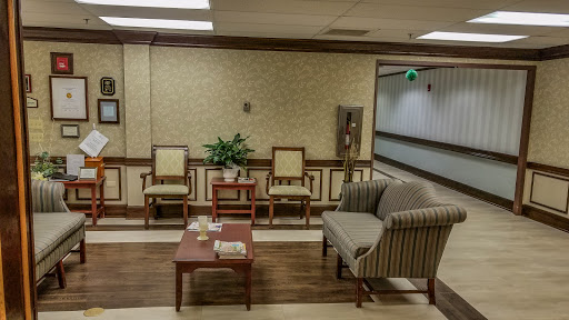 A cozy waiting area featuring comfortable seating and decorative elements.