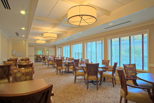 A spacious and elegantly designed lounge area with ample seating and natural light.
