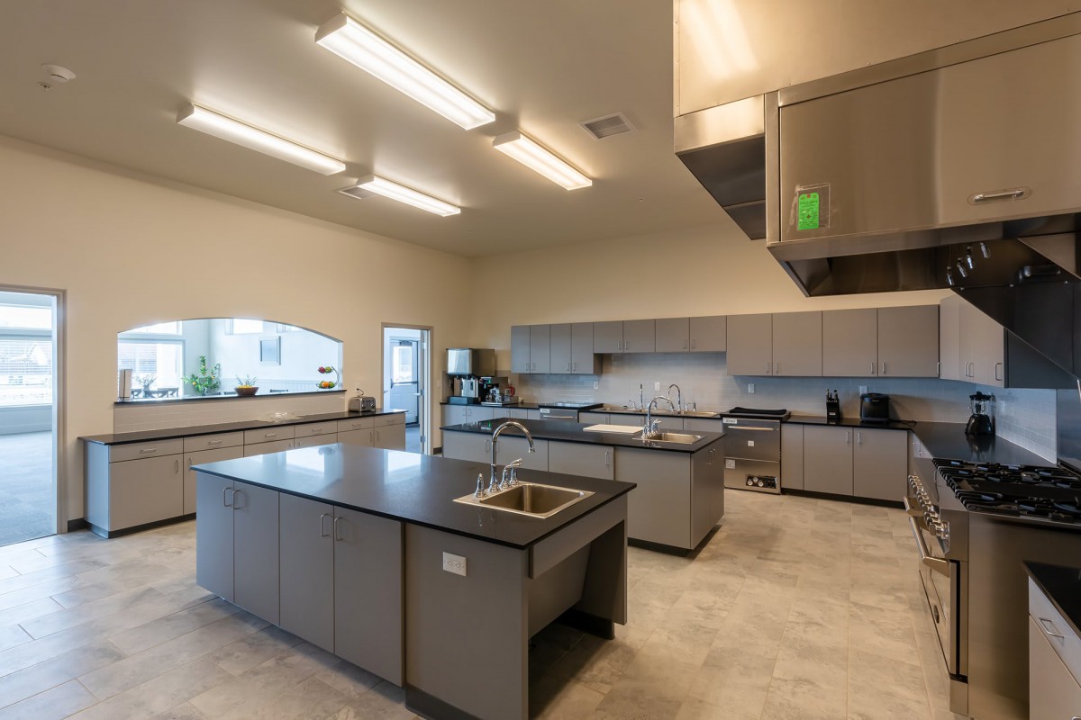 A modern kitchen interior with sleek countertops and ample lighting.
