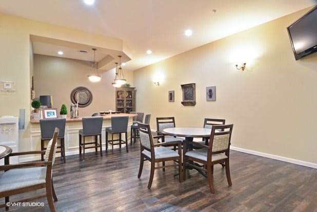 A modern dining area with bar seating and contemporary decor.