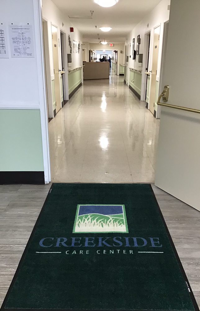 Entrance to Creekside Care Center with a hallway in view.