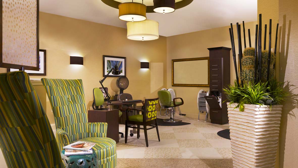 A modern salon interior with stylish decor and comfortable seating.