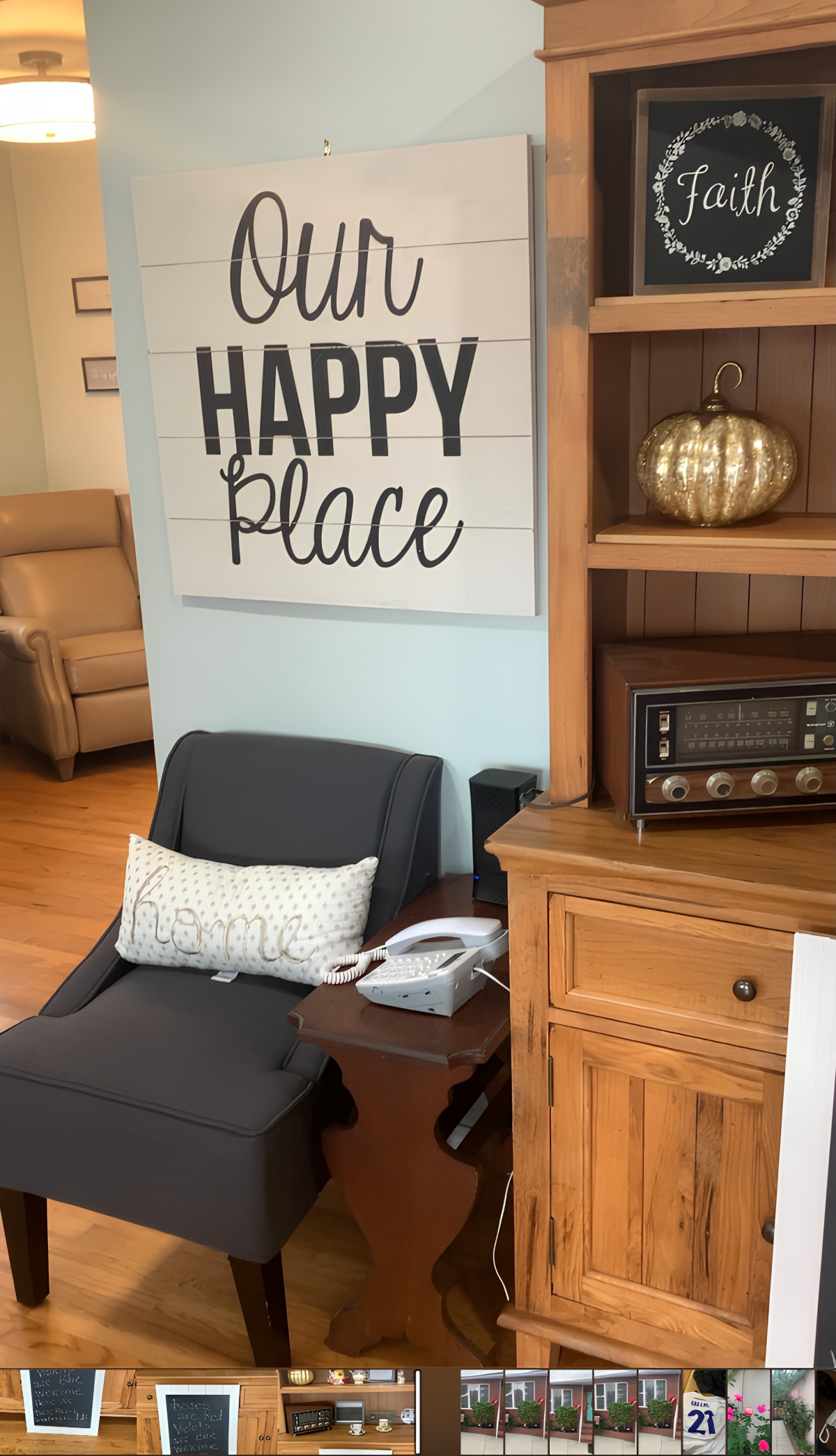 A cozy living room corner with a chair, side table, and decor.