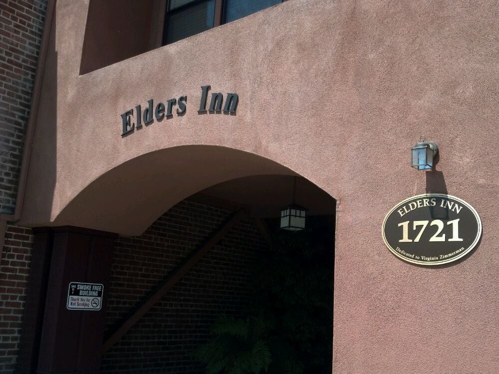 Entrance to Elders Inn with visible signage and address.