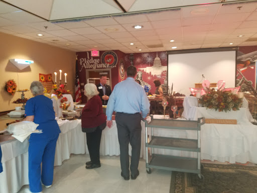 A lively gathering with a buffet setup, showcasing a variety of dishes and an inviting atmosphere.
