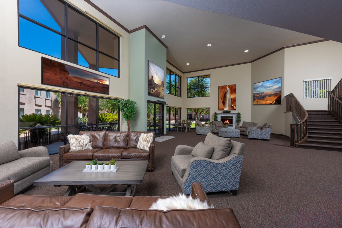 A spacious and modern lobby with comfortable seating areas and large windows.