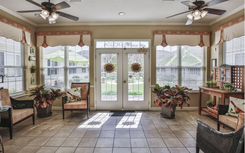 A cozy interior space featuring French doors and abundant natural light.